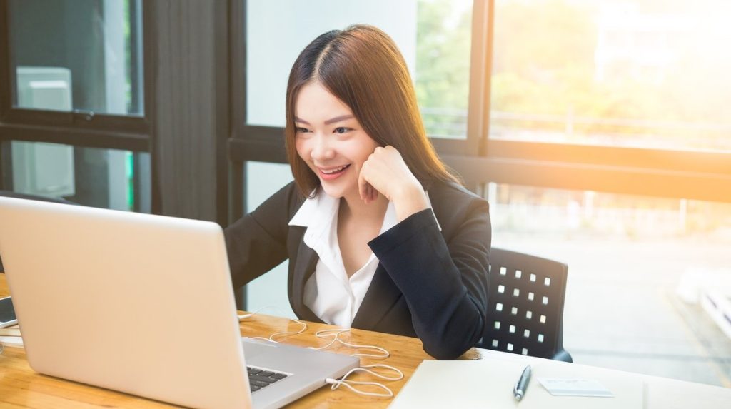 Young Happy Asian Business Woman Doing Online Purchase Or Bankin